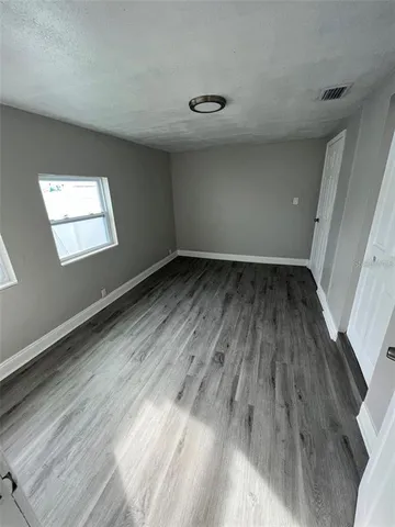 a view of an empty room and window