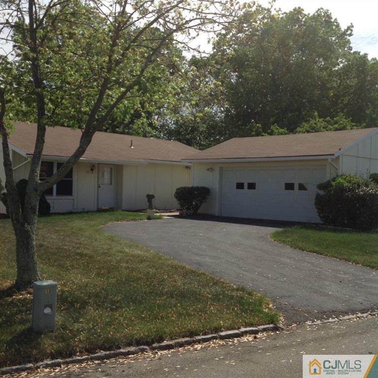 38 C Haddon Road Monroe Township, NJ 08831 - Photo 1 of 19 a front view of a house with a garden