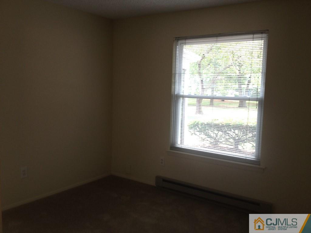 38 C Haddon Road Monroe Township, NJ 08831 - Photo 13 of 19 a view of an empty room and a window