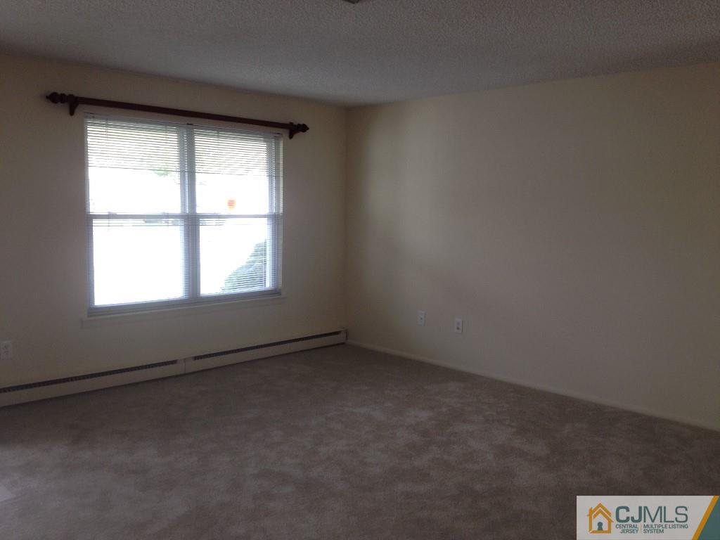 38 C Haddon Road Monroe Township, NJ 08831 - Photo 6 of 19 an empty room with a window