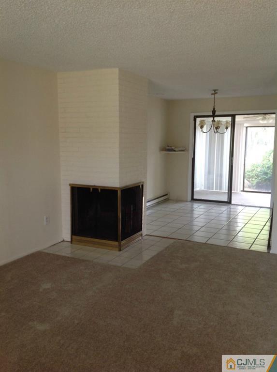 38 C Haddon Road Monroe Township, NJ 08831 - Photo 7 of 19 an empty room with windows