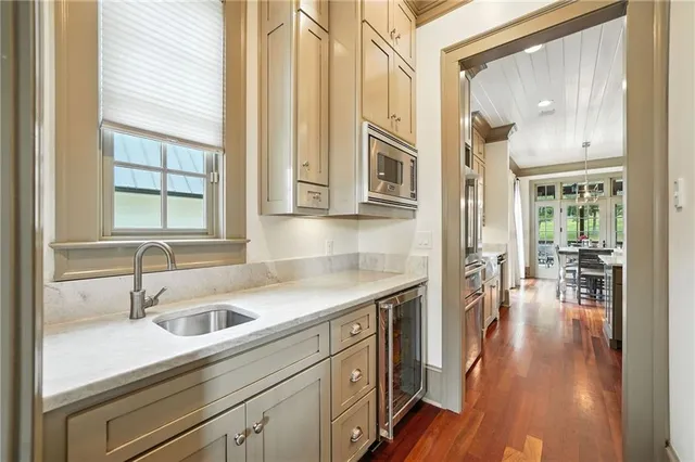 a bath tub sitting in a bathroom next to a window