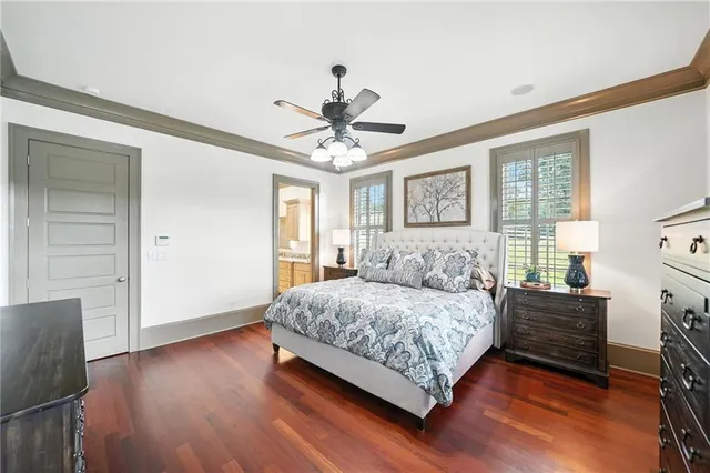 a living room with furniture kitchen view and a flat screen tv