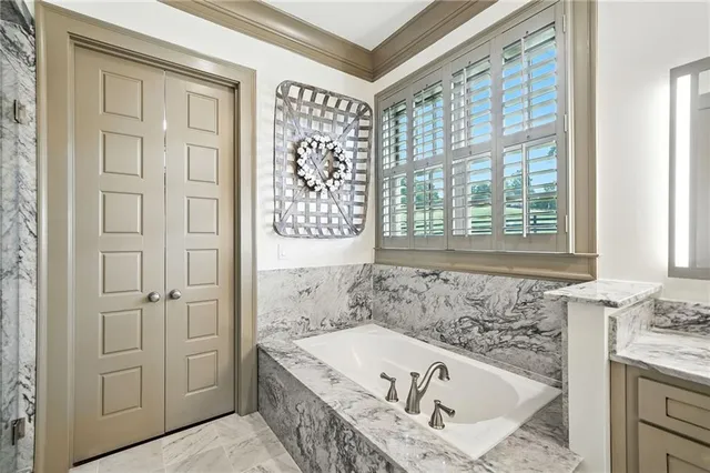 a view of a livingroom with workspace and a window