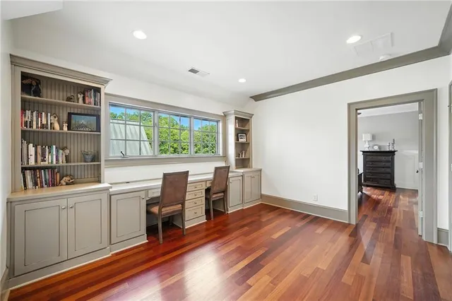 a balcony with furniture and a fireplace