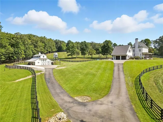 a view of a swimming pool with a yard