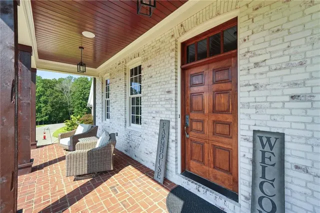 a kitchen with stainless steel appliances granite countertop a large stove a sink dishwasher and a refrigerator with wooden floor