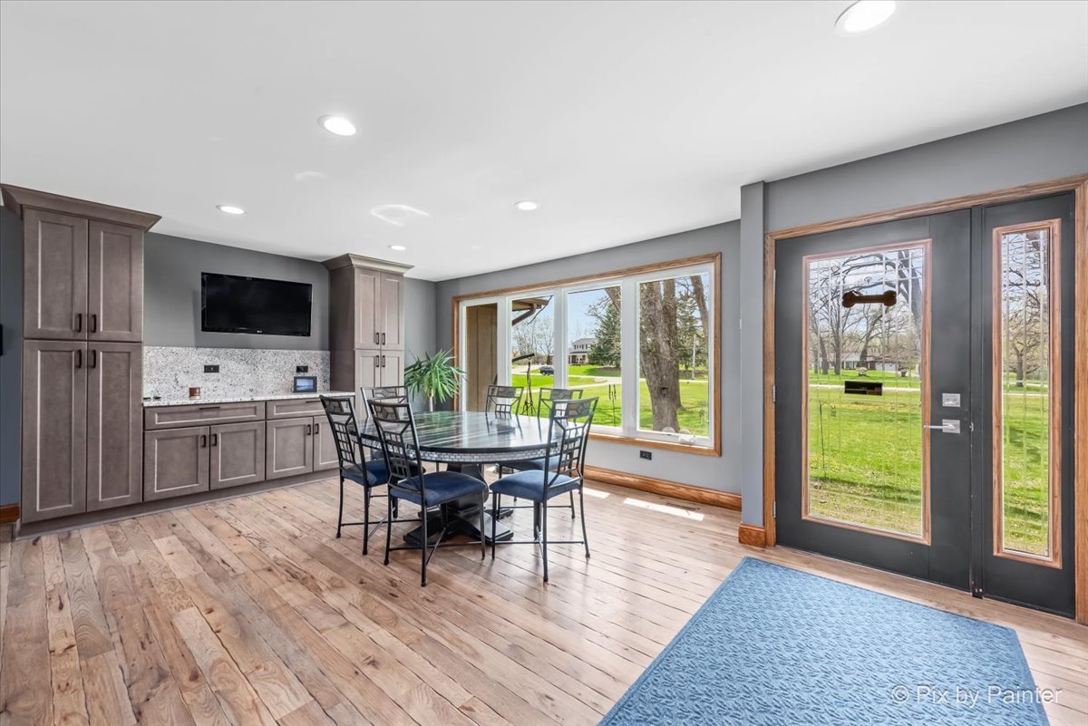 18570 Stevens Road Marengo, IL 60152 - Photo 11 of 45 a view of a dining room with furniture and wooden floor