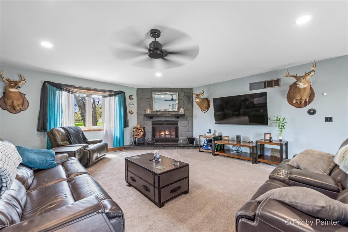 18570 Stevens Road Marengo, IL 60152 - Photo 15 of 45 a living room with furniture and a flat screen tv