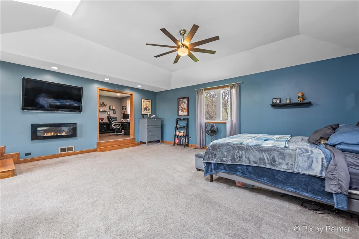 18570 Stevens Road Marengo, IL 60152 - Photo 20 of 45 a bedroom with a bed and a flat screen tv