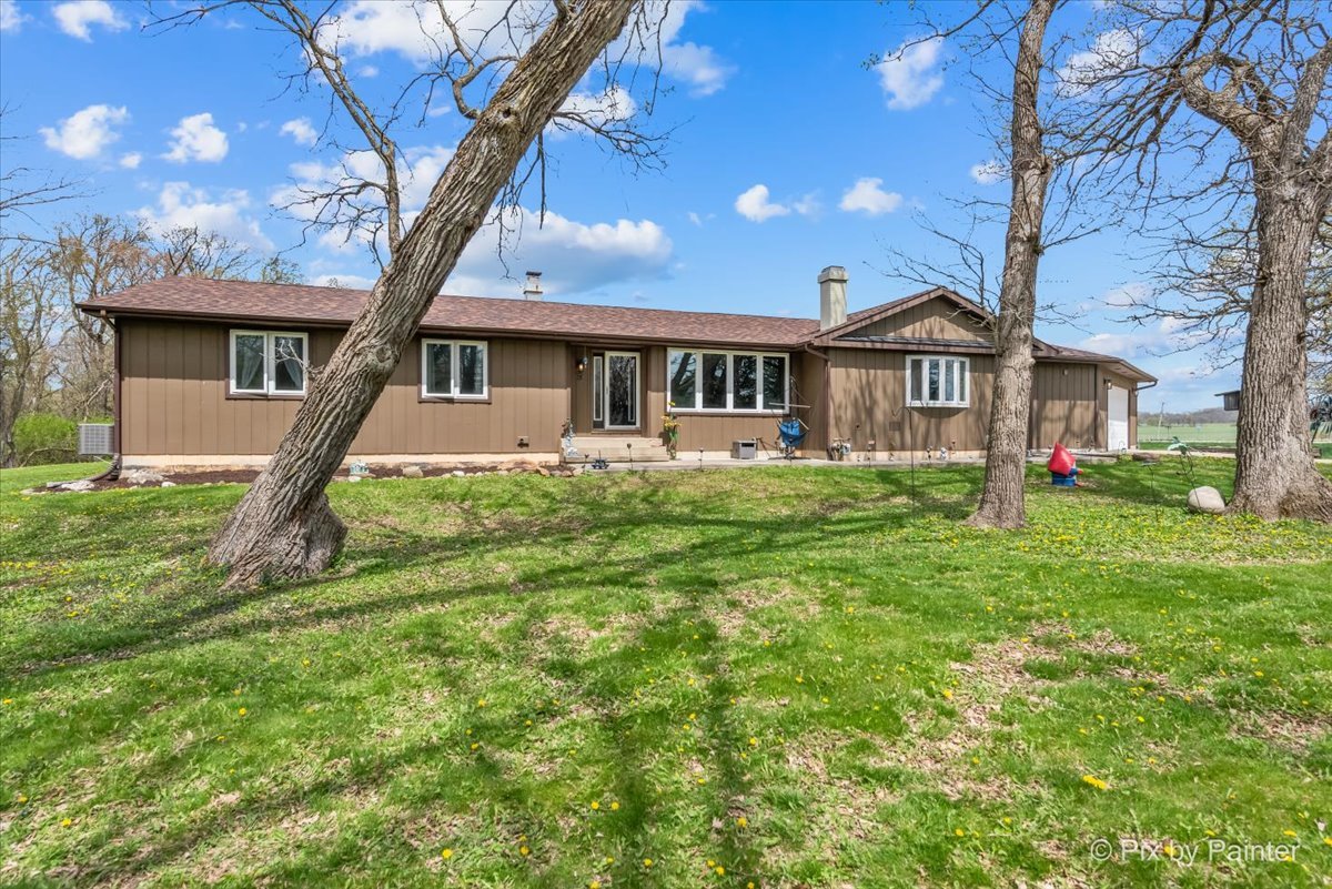 18570 Stevens Road Marengo, IL 60152 - Photo 2 of 45 a front view of a house with a yard