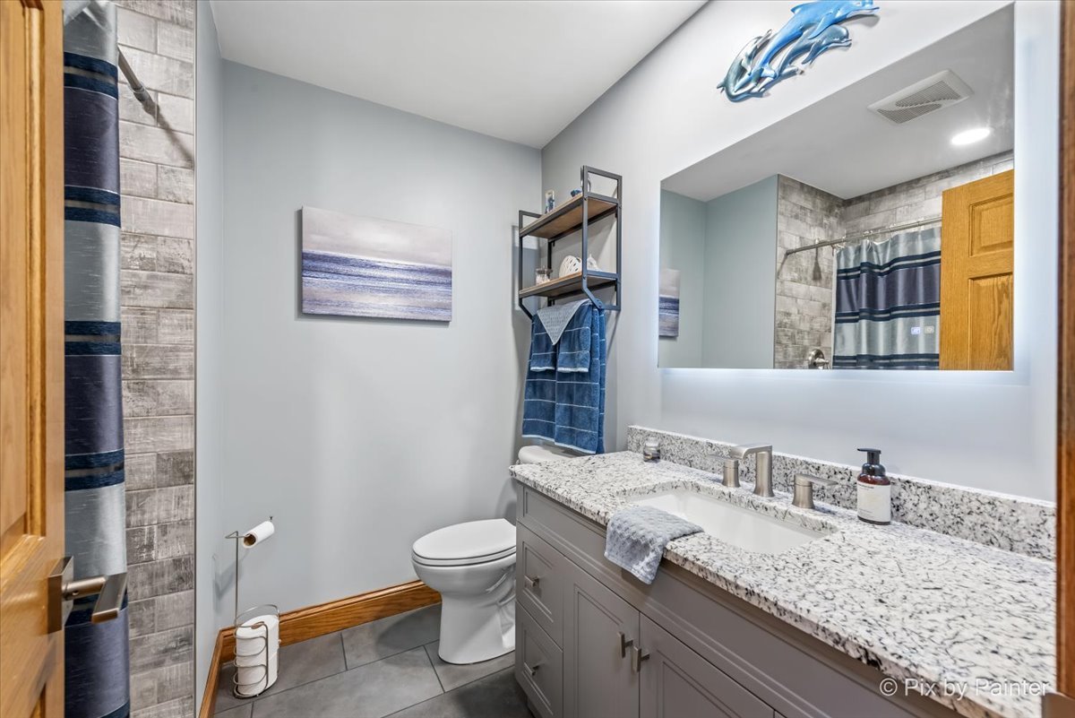 18570 Stevens Road Marengo, IL 60152 - Photo 26 of 45 a bathroom with a granite countertop sink toilet and shower