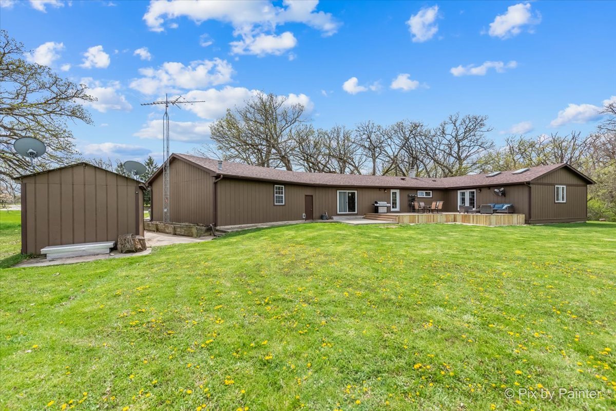 18570 Stevens Road Marengo, IL 60152 - Photo 31 of 45 a front view of house with yard and trees in the background