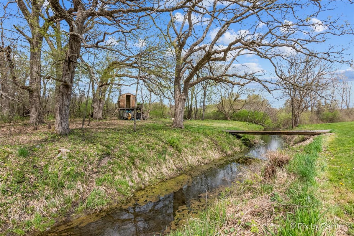 18570 Stevens Road Marengo, IL 60152 - Photo 33 of 45 a backyard of a house with lots of green space