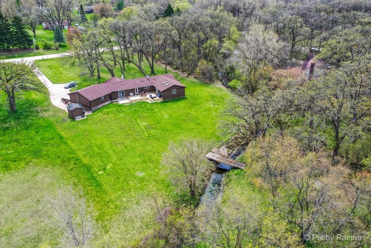 18570 Stevens Road Marengo, IL 60152 - Photo 41 of 45 a backyard of a house with lots of green space
