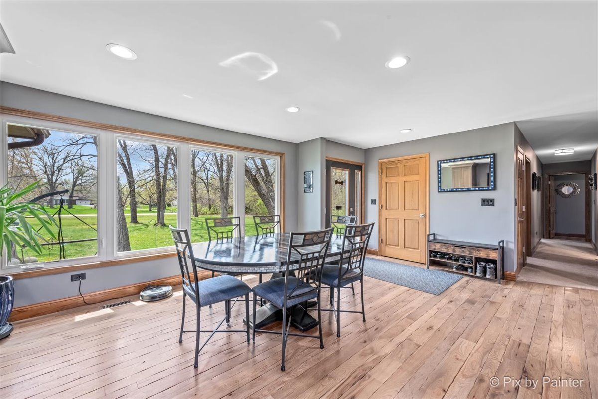18570 Stevens Road Marengo, IL 60152 - Photo 10 of 45 a view of a dining room with furniture window and wooden floor