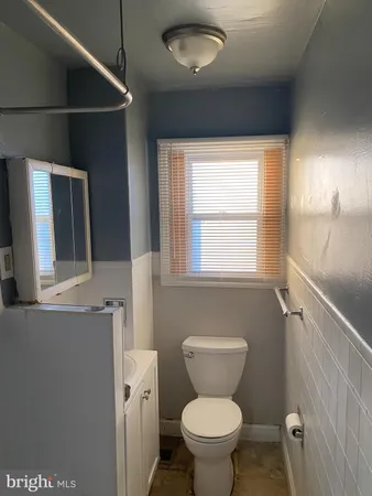 a bathroom with a toilet and a sink