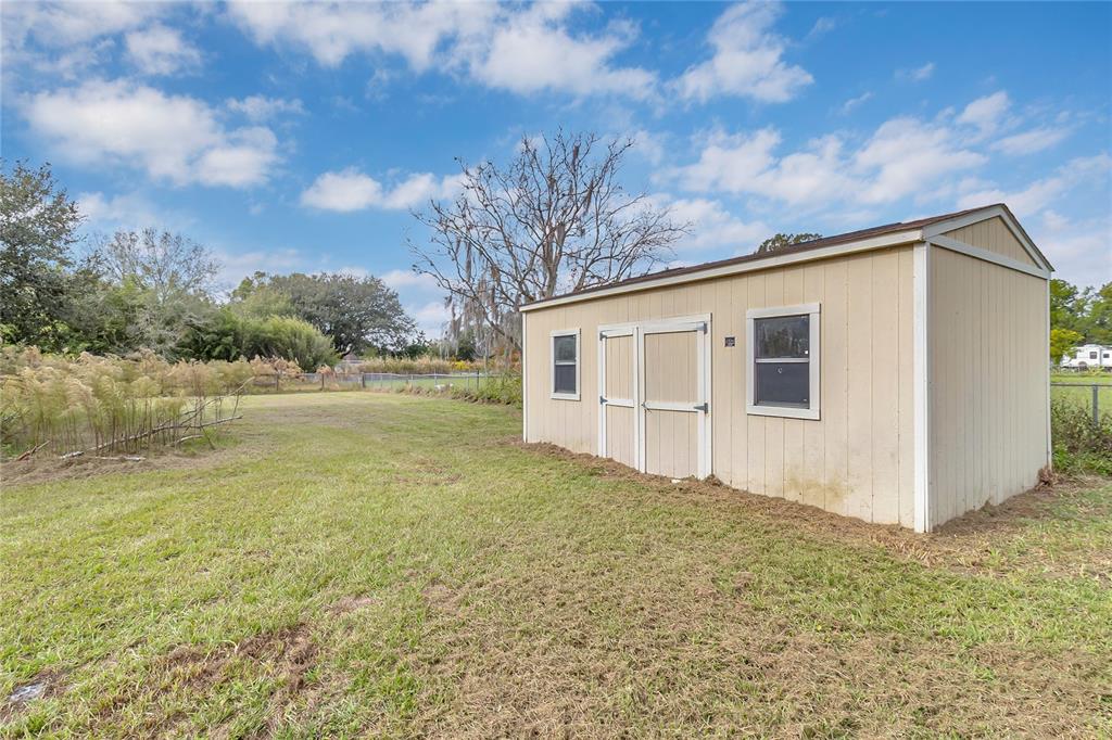 4685 D Street St. Cloud, FL 34772 - Photo 13 of 15 a view of a backyard of the house