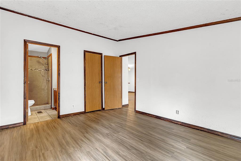 4685 D Street St. Cloud, FL 34772 - Photo 7 of 15 a view of an empty room with wooden floor and a window