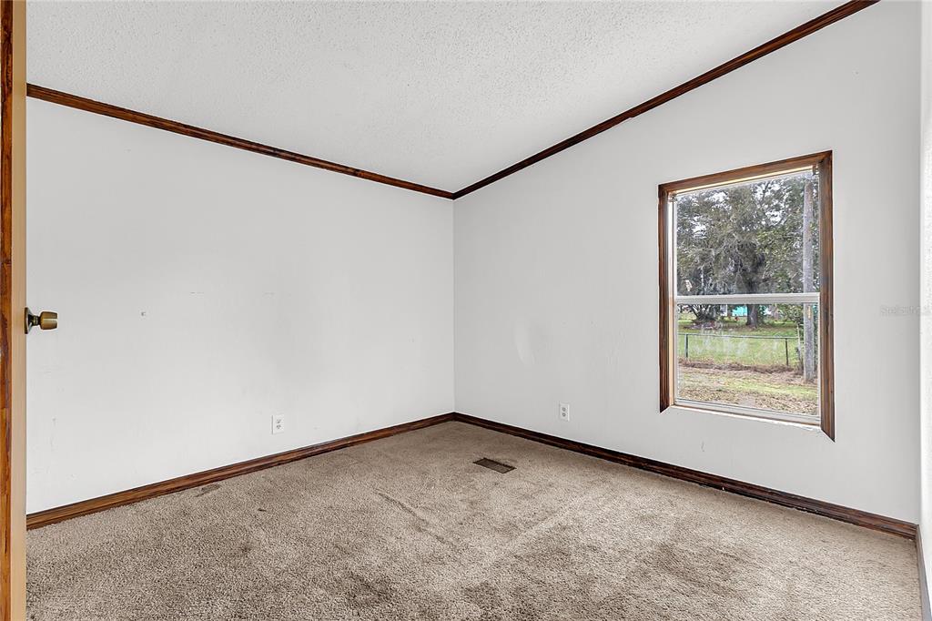 4685 D Street St. Cloud, FL 34772 - Photo 10 of 15 an empty room with a window