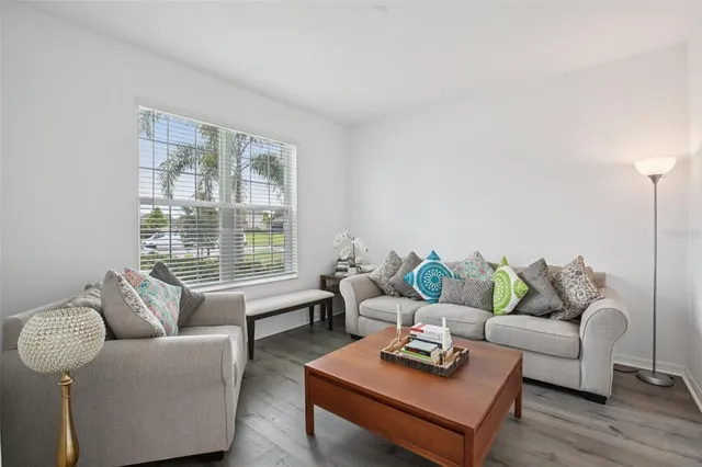 a living room with furniture and a window