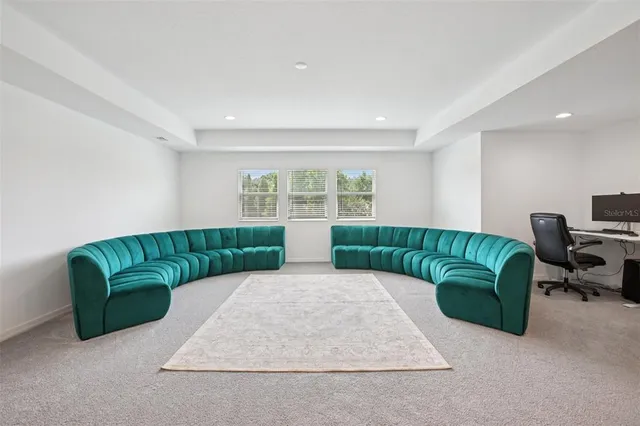 a living room with a couch and a large window