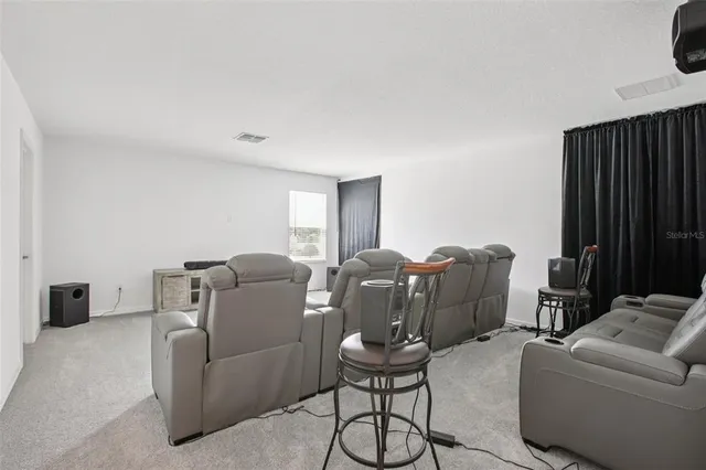 a hotel room with large bed and furniture
