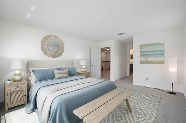 an empty room with an entryway and closet