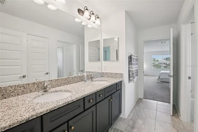 a bathroom with a shower curtain and a window