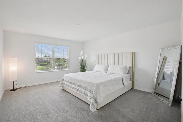 a bedroom with a bed and a cabinets