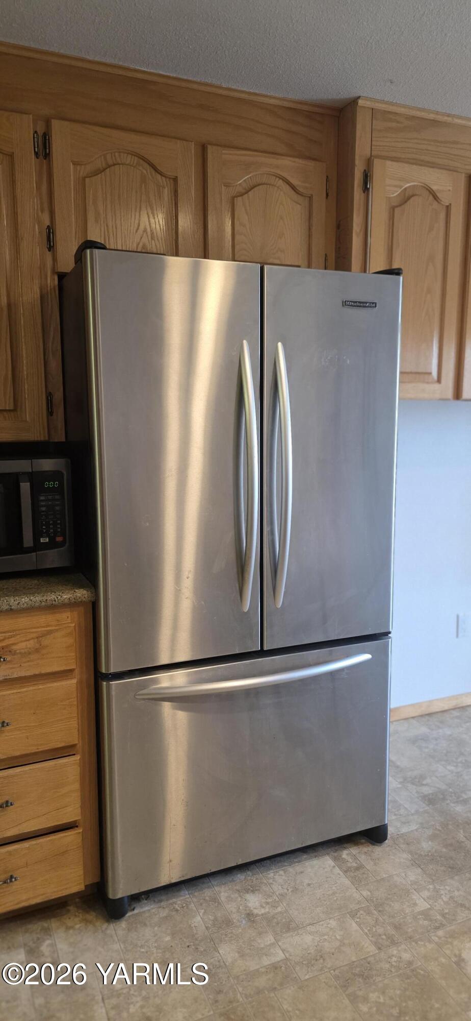 8601 Scenic Drive Yakima, WA 98908 - Photo 9 of 52 a view of a refrigerator in kitchen