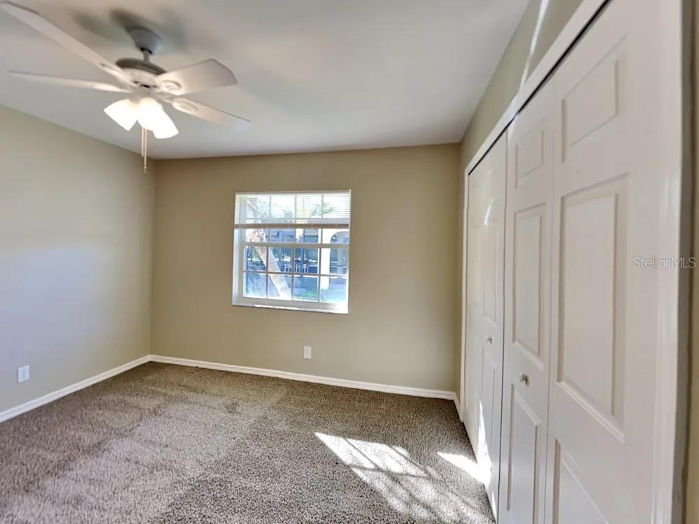22 Cabello Street Punta Gorda, FL 33983 - Photo 12 of 15 an empty room with windows and fan
