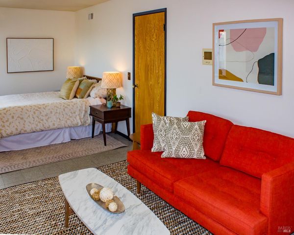 a view of bathroom with a sink mirror and toilet