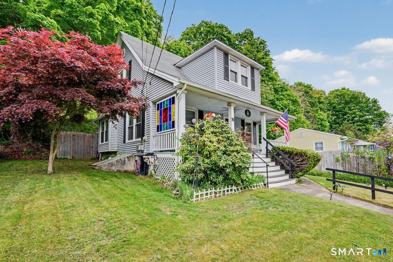74 Maple Street Seymour, CT 06483 - Photo 3 of 40 a view of a house with a yard and sitting area
