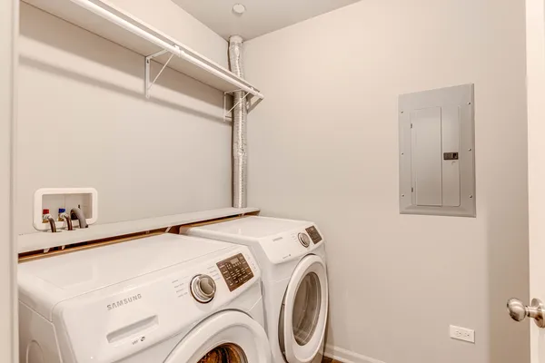 a utility room with dryer and washer