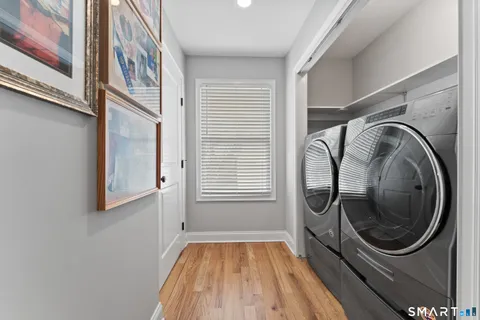 a view of a hallway with washer and dryer
