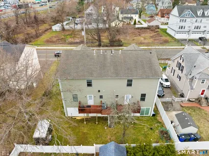 an aerial view of a house with swimming pool