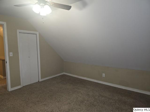 303 North Washington Street Carthage, IL 62321 - Photo 20 of 25 an empty room with a chandelier fan