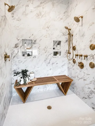 a bathroom with a bathtub sink and mirror