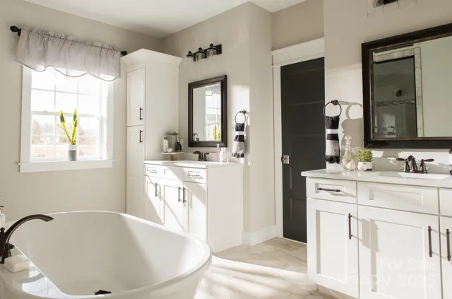 a bathroom with a bathtub and shower