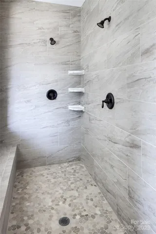 a white bath tub sitting in a bathroom