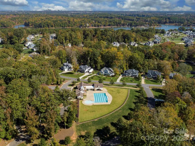 a view of a swimming pool with a yard