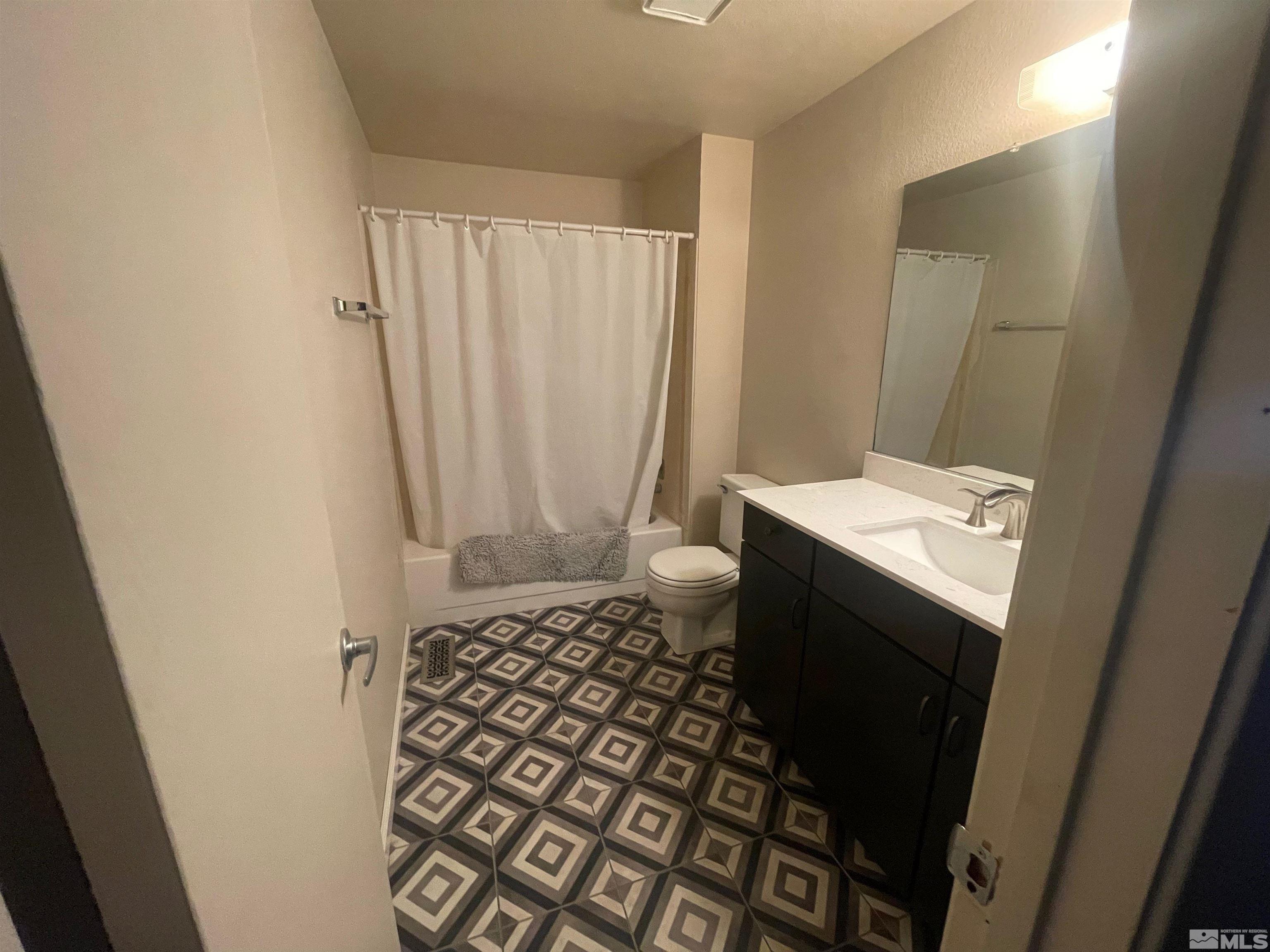 7550 Bluestone Drive Reno, NV 89511 - Photo 11 of 15 a bathroom with a sink and a mirror