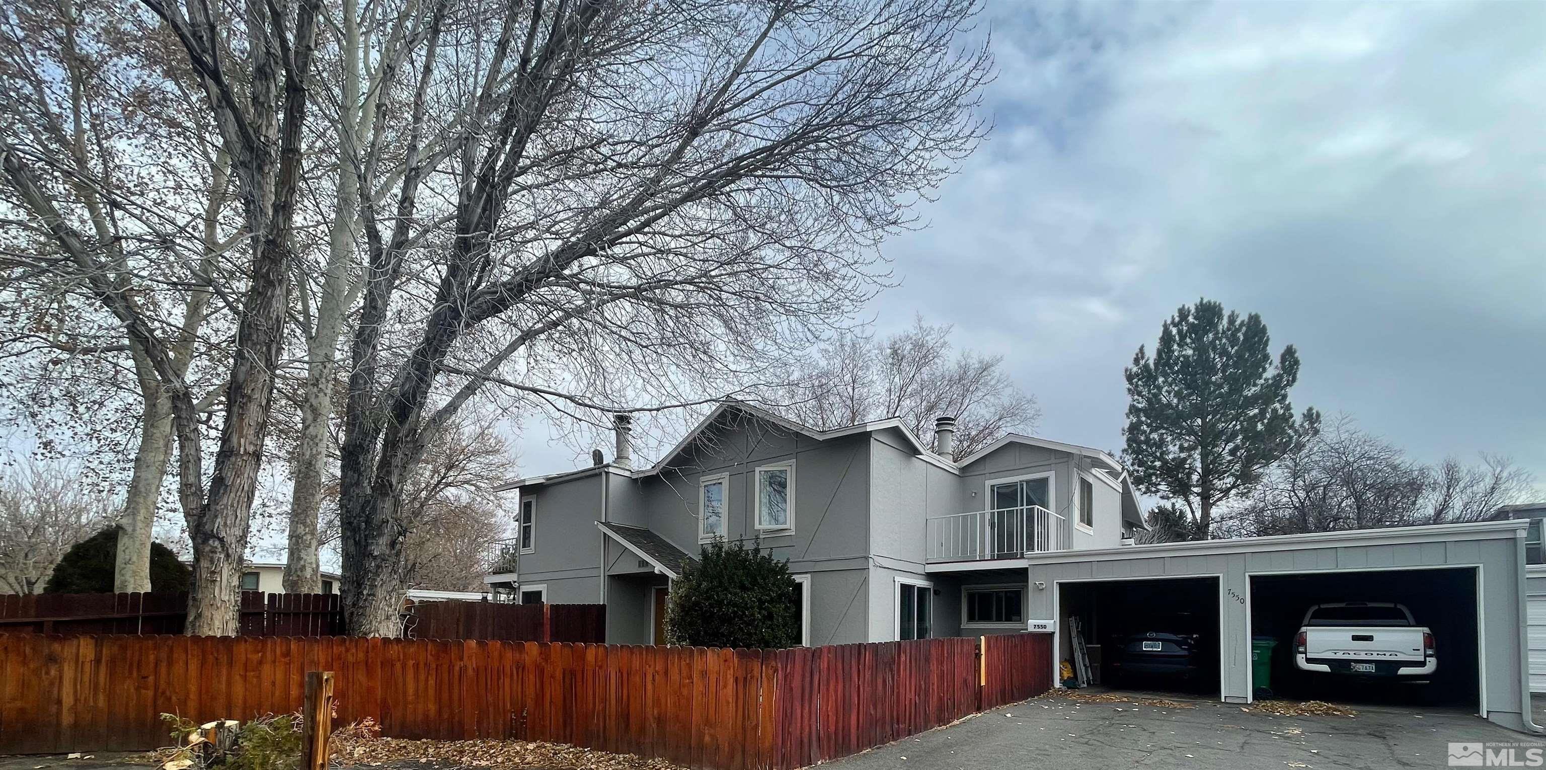 7550 Bluestone Drive Reno, NV 89511 - Photo 2 of 15 a front view of a house with a garage