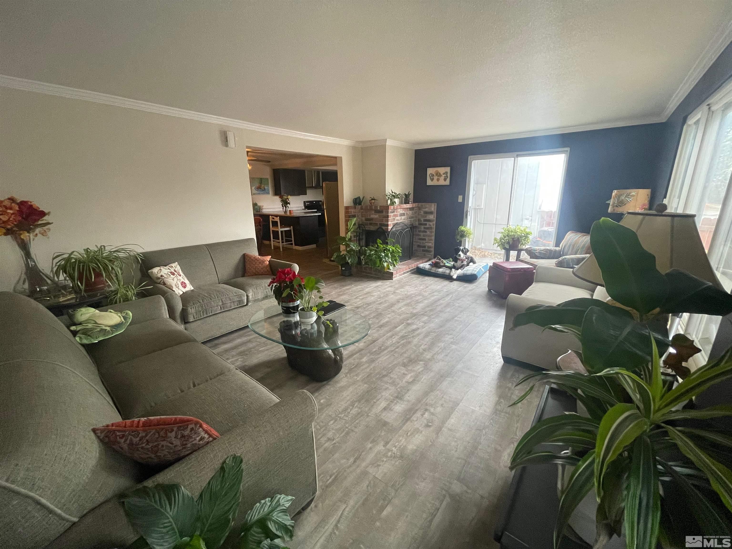 7550 Bluestone Drive Reno, NV 89511 - Photo 3 of 15 a living room with furniture potted plant and a window