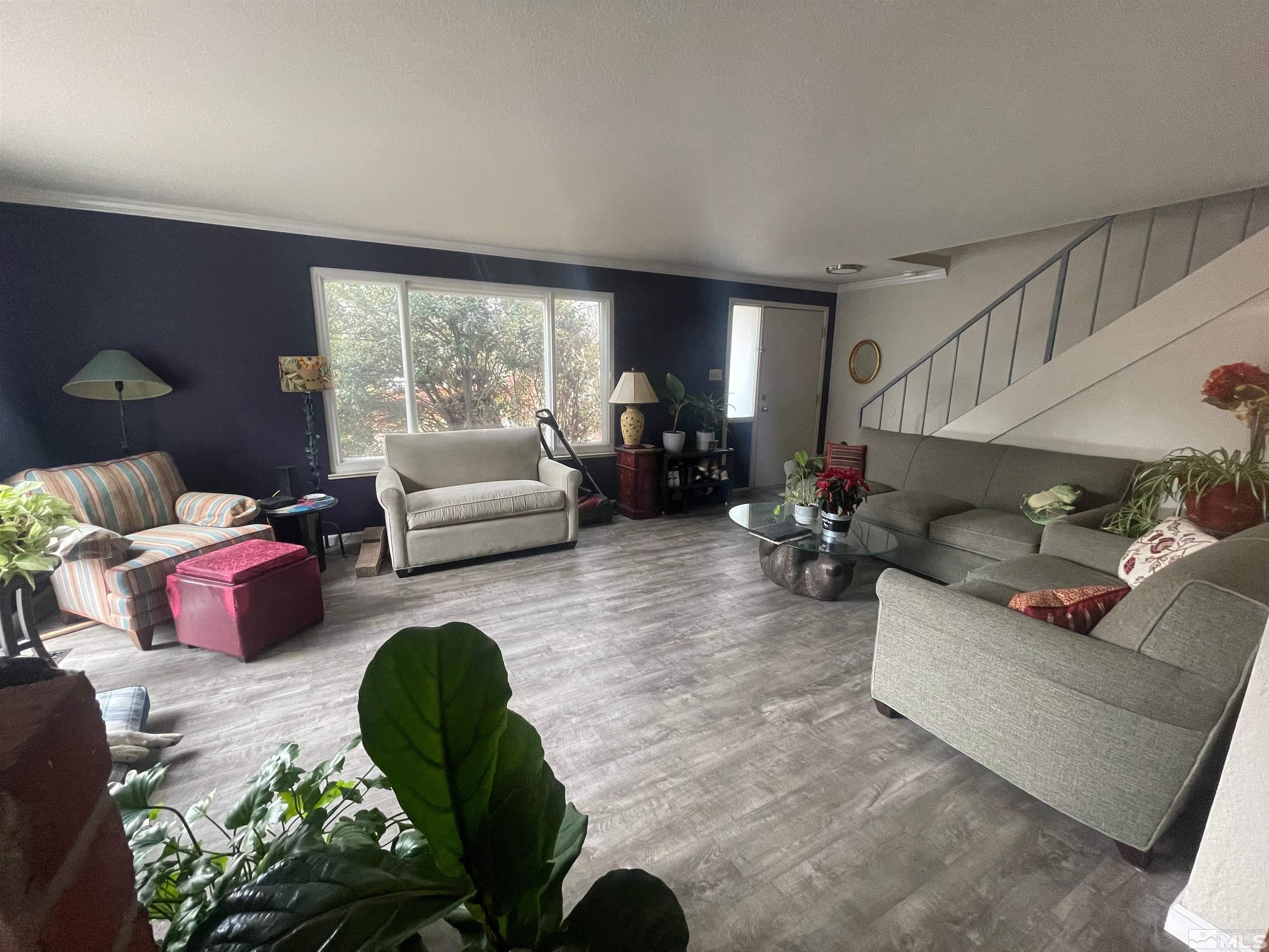 7550 Bluestone Drive Reno, NV 89511 - Photo 4 of 15 a living room with furniture and a large window
