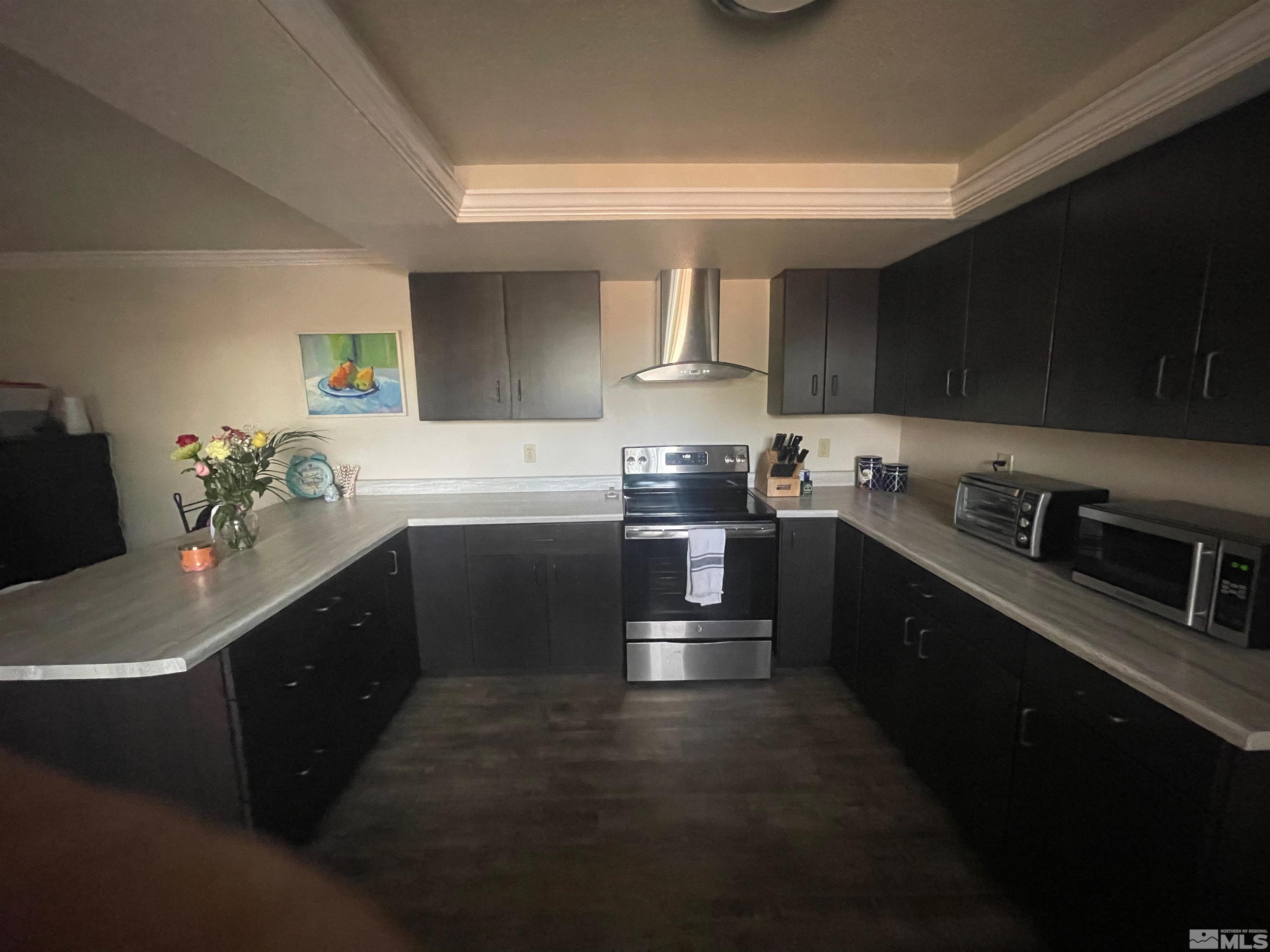 7550 Bluestone Drive Reno, NV 89511 - Photo 7 of 15 a kitchen with a sink stove and cabinets
