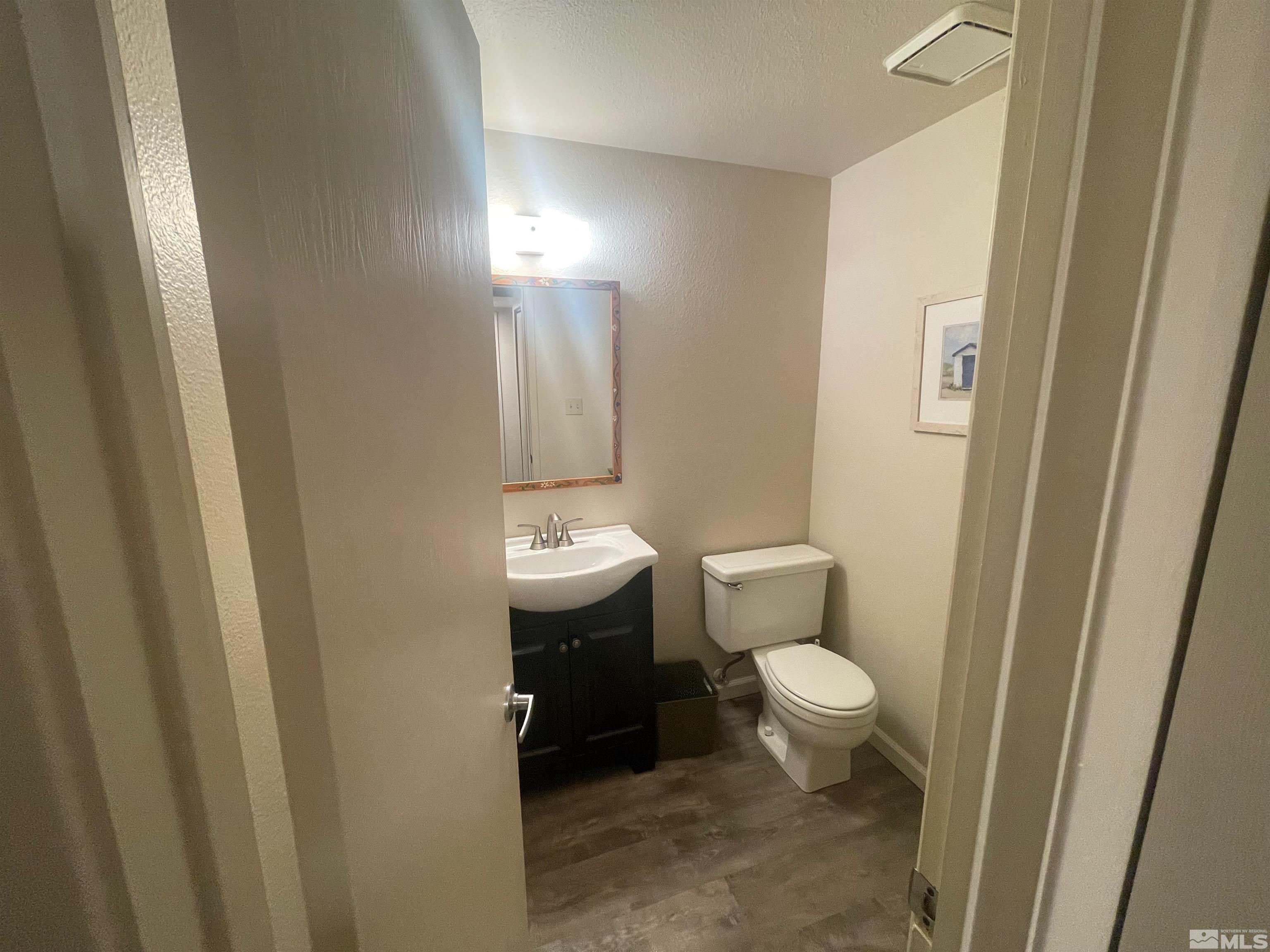 7550 Bluestone Drive Reno, NV 89511 - Photo 9 of 15 a bathroom with a toilet and a sink