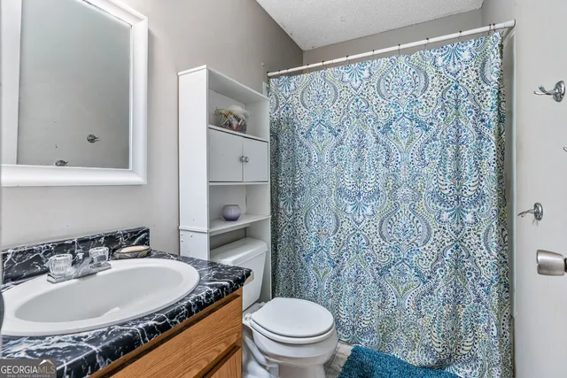 a bedroom with bed and a window