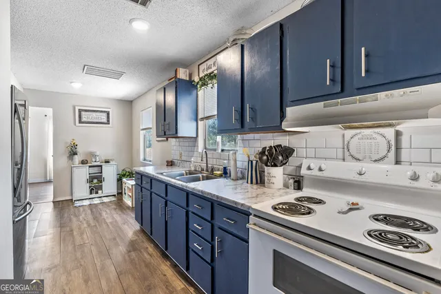 a white toilet sitting next to a bathroom sink